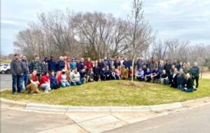 Dedicated Networks team on Arbor Day, planting trees 